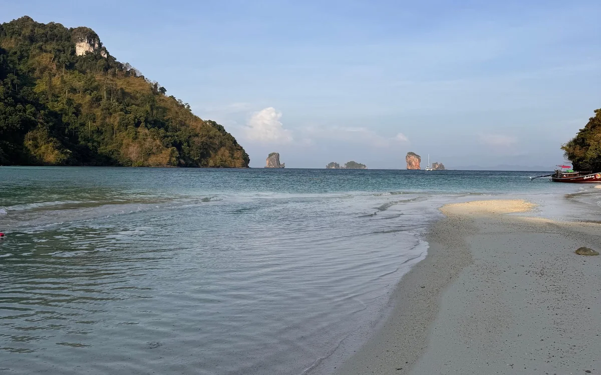 The white sand beach of Maya Bay under limestone cliffs on Koh Phi Phi Leh