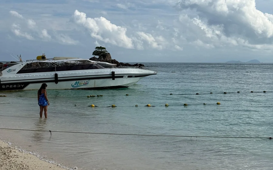 The clear shallow water and white sand of Khai Island
