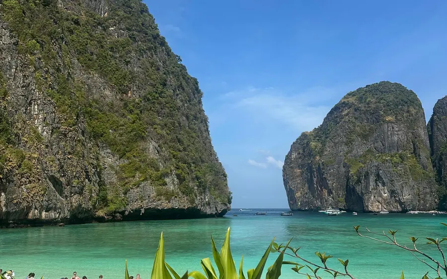 A speedboat off the limestone cliffs of the Phi Phi Islands