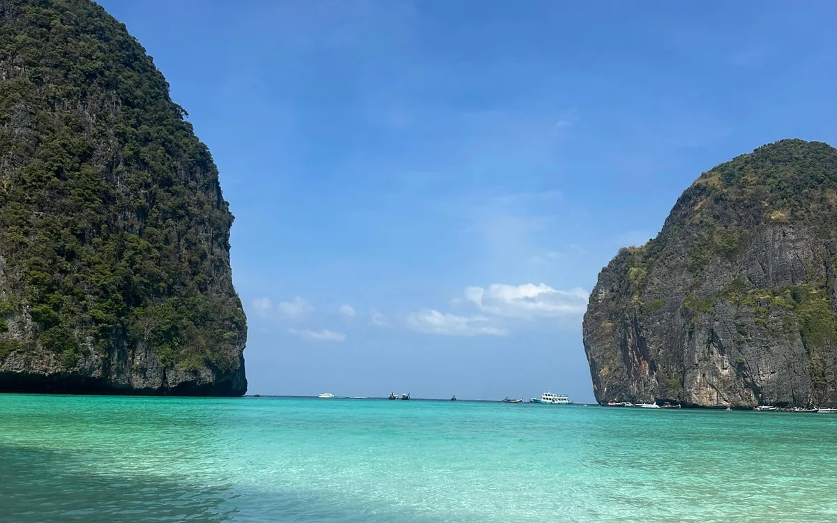 A speedboat crossing the open water of the Andaman Sea